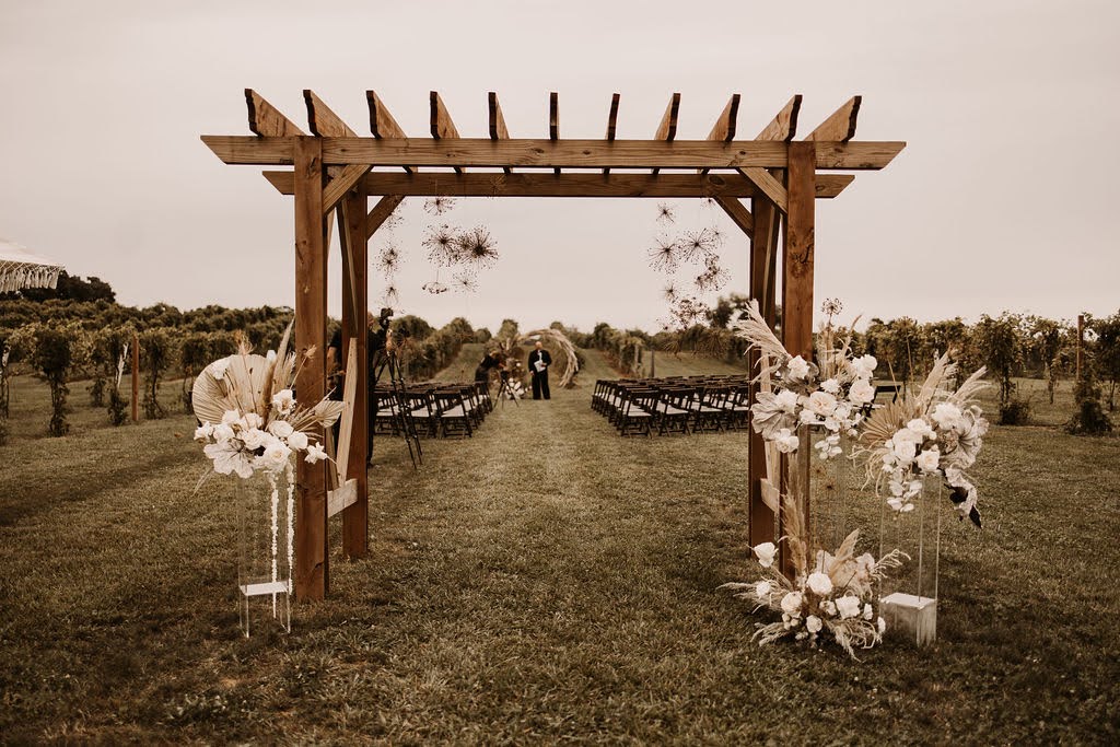 Pergola ceremony setup in vineyard at Providence Vineyard wedding venue