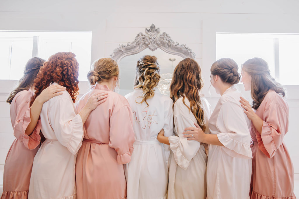 bride and bridesmaids matching robes bridal suite at Providence Vineyard WEdding Venue