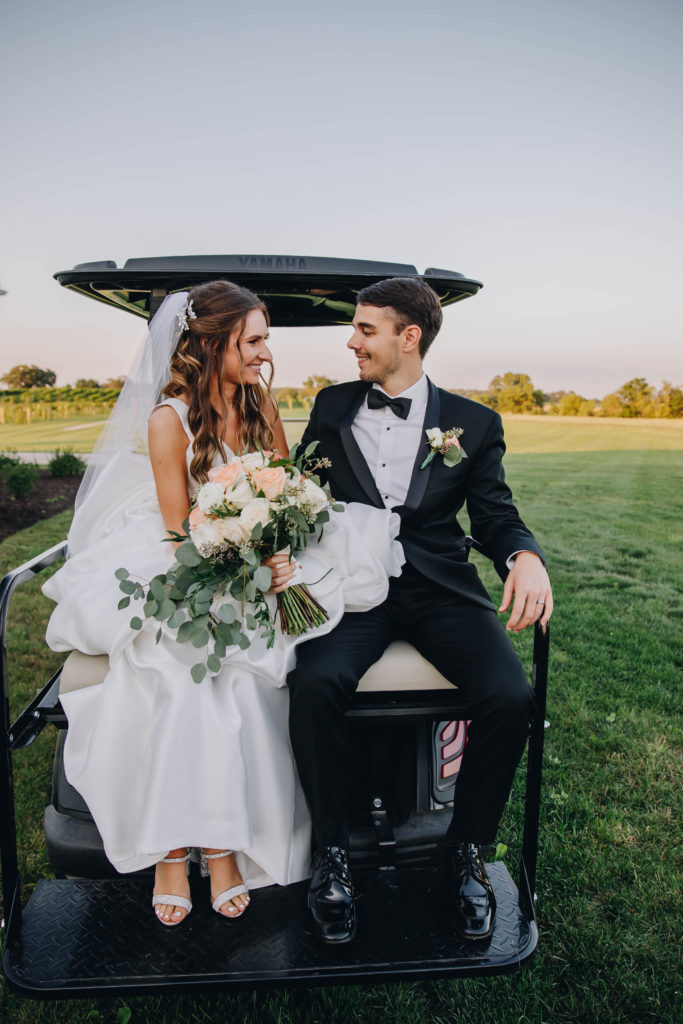 bride and groom on back of golf cart at Providence Vineyard WEdding Venue