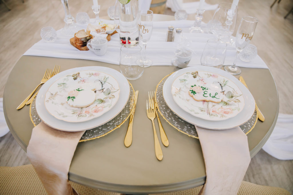 table scape gold dinnerware reception at wedding at Providence Vineyard Wedding Venue