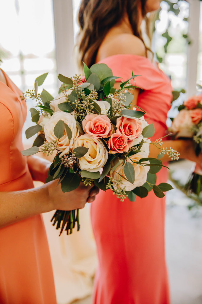 Bridesmaids holding floral boquet wedding at Providence Vineyard